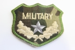0303/15/414/54 - Emblem , Polyester, ca. 70x 60 mm , grün/ beige