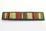 0303/15/416 - Emblem , Polyester, ca. 67x 15 mm , schwarz/ grün/ beige/ rot